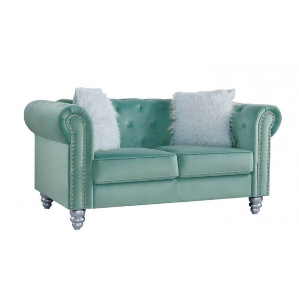 Sofá capitoné 2 cuerpos capitoné tapizado en terciopelo verde agua con cojines decorativos.